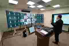 man in front of class using weconnect
