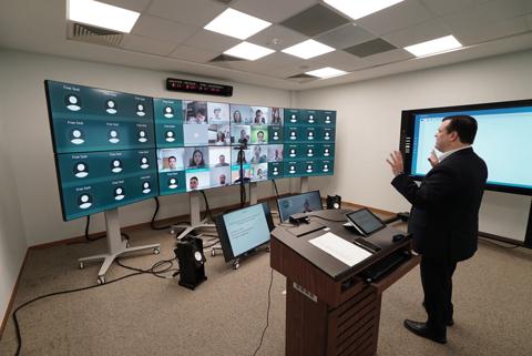 man in front of class using weconnect