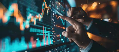 Businessman analyzing financial data on interactive screen. stock market trading