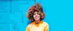 truepix blog stock adobe black woman in front of blue wall