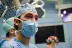 A doctor in a digital operating room with surgical displays