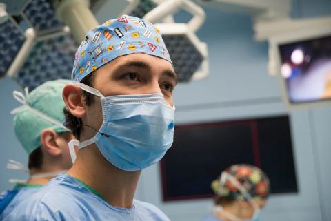 A doctor in a digital operating room with surgical displays