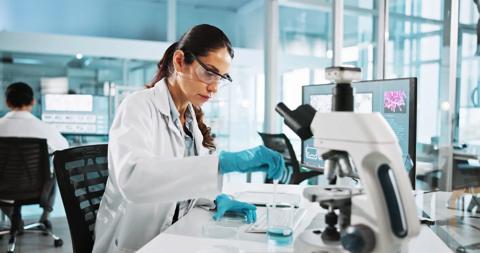Scientist, woman and research with beaker at lab with sample, liquid and test with pharma career. Person, ppe and equipment with chemical process for medical innovation, vaccine and clinical study.