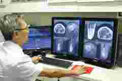 A radiologist at Ramsay Health Care Hospital using Barco Nio medical displays