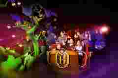 A family enjoys a dark ride Basilik powered by Barco projectors at Legendia, Poland
