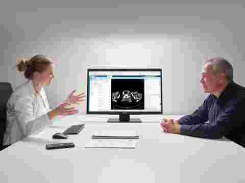 A Barco Eonis Color 8MP (MDRC-8132) display in a physician's cabinet helps provide doctor-patient consultation