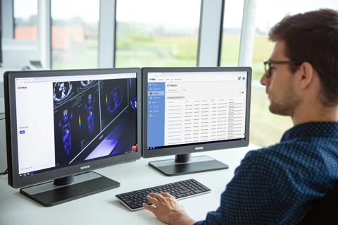 IT responsible looking at two Eonis screens with QAWeb interface, 2019 release