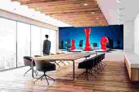 boardroom with TruePix Smart Move campaign visual on screen