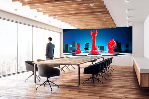 boardroom with TruePix Smart Move campaign visual on screen