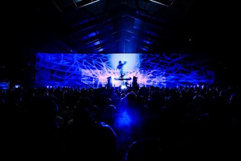 Kortrijk Club of the Future projection mappings in industrial hall transformed into immersive dance floor