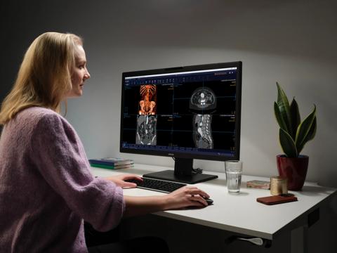 A radiologist looking at diagnostic images on a Barco Nio Color 8MP (MDNC-8132) radiology display