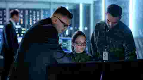Government Surveillance Agency and Military Joint Operation. Male Agent, Female and Male Military Officers Working at System Control Center.