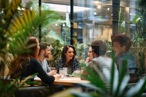 A group of people sitting around a table in a greenhouse Generative AI