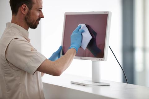 cleaning the front cover of an Eonis display (white)