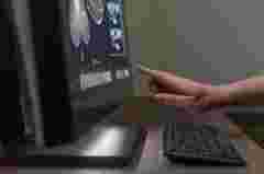 OneLook touch bar close-up with pointing finger