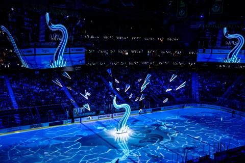 customer story pictures from on ice projection mapping in Climate Pledge Arena for NHL Seattle Kraken ice hockey team