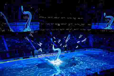 customer story pictures from on ice projection mapping in Climate Pledge Arena for NHL Seattle Kraken ice hockey team