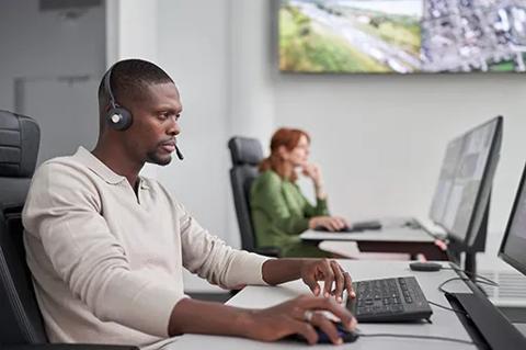 small version of control room operators matching barco logo