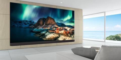 3D rendering of modern living room with TV screen and sofa on sea background."t