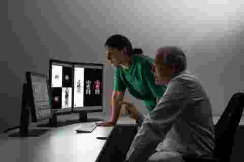 Radiologists reading diagnostic images on Barco displays