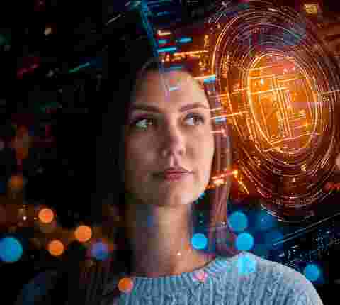 Visioneering Barco colleague, looking at hogographic data, immersed in sparkles