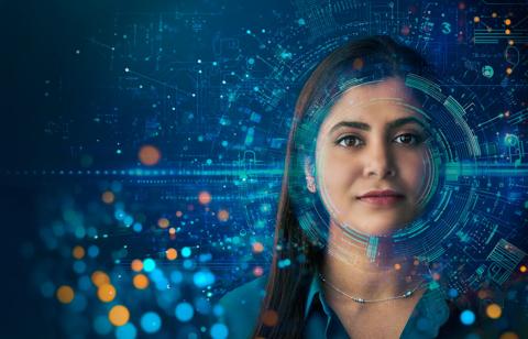 Visioneering Barco colleague surrounded by holographic data and light sparkles