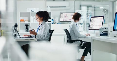 Science, laboratory and people on computer for medical analysis and digital pathology. Healthcare, pathology team and female assistants with equipment for software aided scan qualification. DPQA.