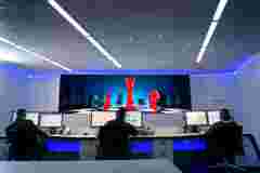 control room with TruePix Smart Move campaign visual on screen