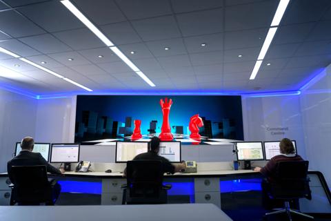 control room with TruePix Smart Move campaign visual on screen