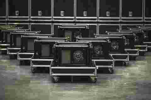 A group of UDM projectors in rental frame standing in warehouse