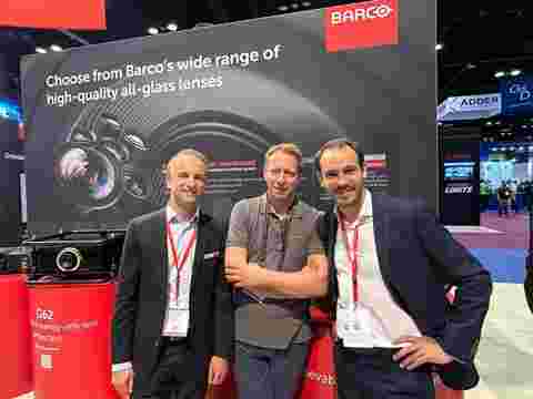 Picture for newsroom AED is preparing for a busy summer with its new Barco UDM fleet. Domien De Witte + Wouter Bonte + Thierry Heldenbergh, Managing Director at AED Display handshake at InfoComm 2023 booth