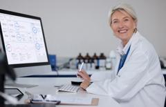 Science portrait, computer and senior pathologist, DPQA dashboard, lab research pathology scan quality control and preselection. Laboratory, medicine study and happy woman. Assistant.