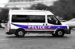 French police customer story vehicle driving through streets in action