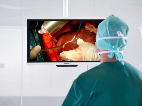 MDSC-8427 display hanging in the OR, with surgeon looking