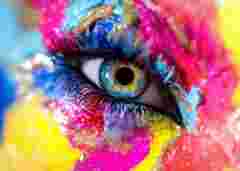 Woman eye with colorful makeup. Macro shot