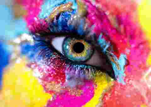Woman eye with colorful makeup. Macro shot
