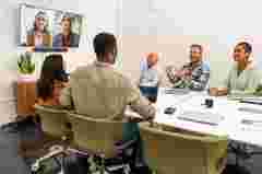 Poly Studio X52 with TC10 Black Lifestyle conference room in video Poly UI call right facing