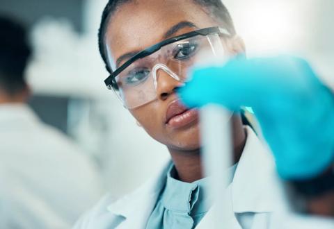 Science, study and black woman with test tube in laboratory, medical engineer and results. Biotechnology, pharmaceutical and research, scientist or lab technician checking vaccine solution in glass