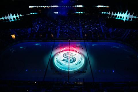 customer story pictures from on ice projection mapping in Climate Pledge Arena for NHL Seattle Kraken ice hockey team