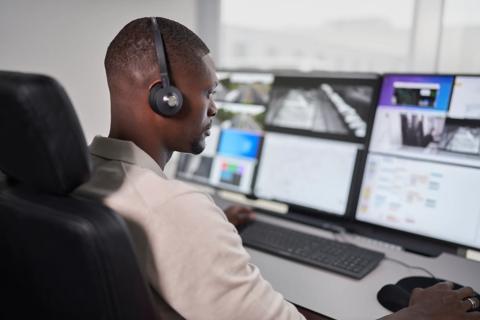 Image of black man in enterprise pod working opspace landscape format