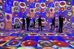 Visitors taking pictures in the IX experience pod