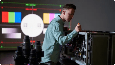 Man servicing a Barco laser projector